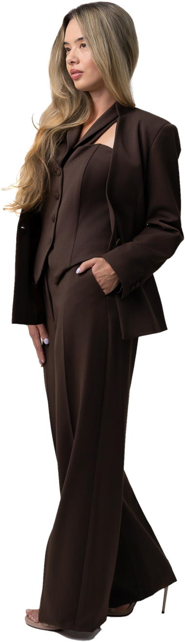 The EMETTE Statement Set in chocolate, worn walking with a hand in the pocket.